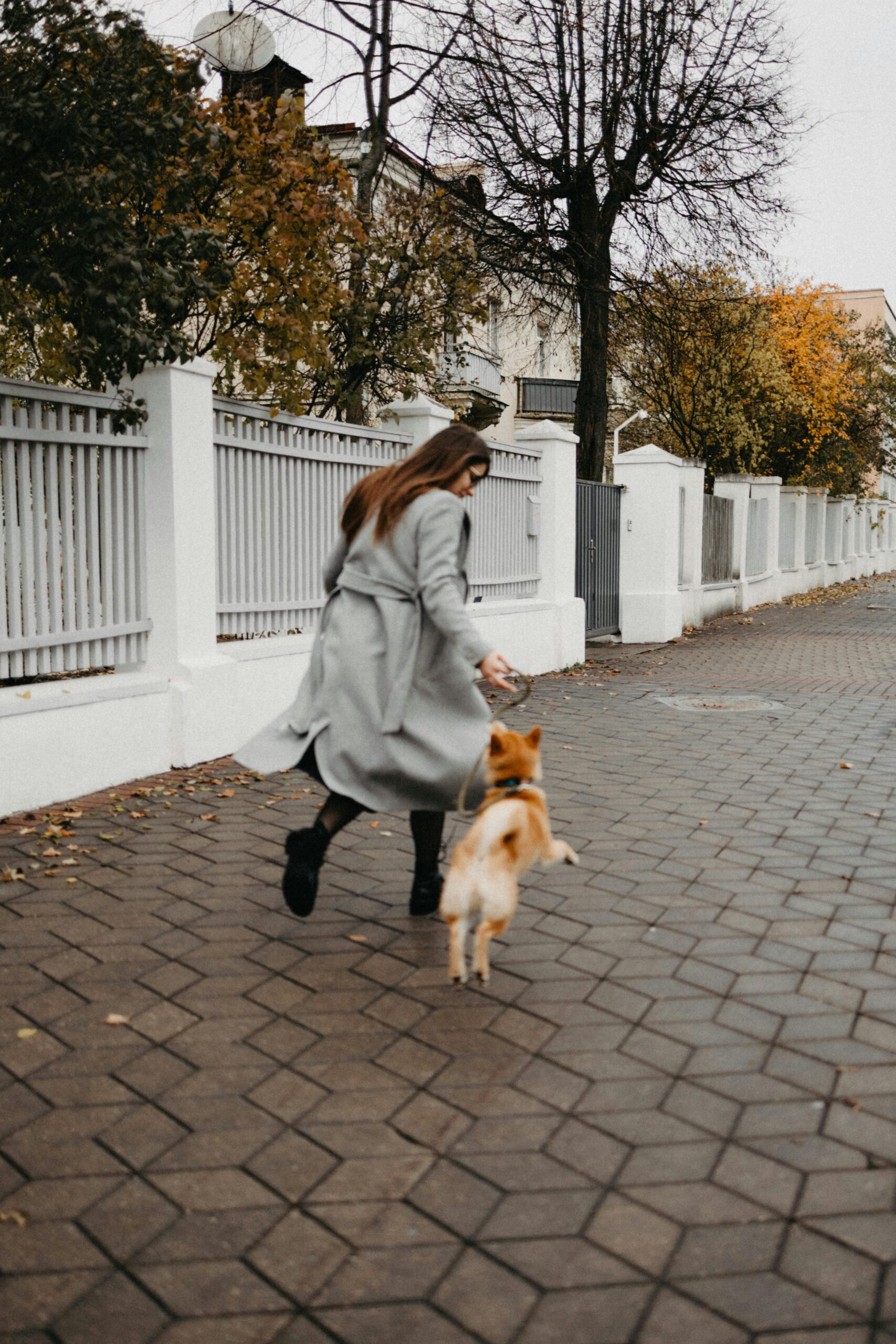 A Woman Running with Her Dog